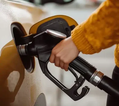 close up, girl at the gas station filling her car